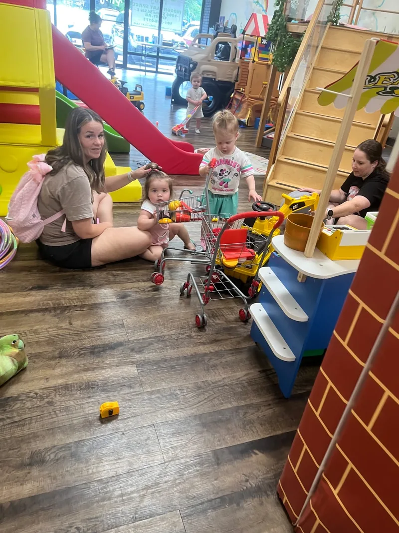 Families playing together inside Fresh Play Cafe
